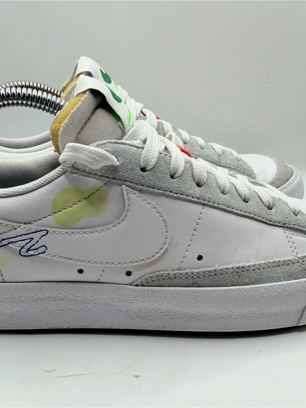 Nike White Low-Top Sneakers with Blue, Green, Yellow and Orange Accents